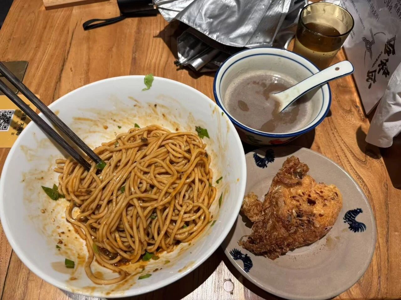 Birthday dinner: a bowl of noodles, a fried egg, and a bowl of soup